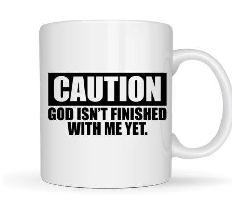 Caution: God Isn't Finished With Me Yet" Mug